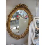 An ornate gilt framed mirror