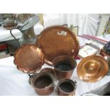 A collection of copper bowls,