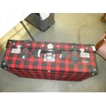 A red tartan suitcase