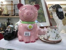 A quantity of pottery and china including pig biscuit barrel
