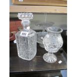 A decanter and other glass and crystal items