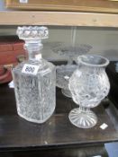 A decanter and other glass and crystal items