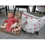 Three vintage dolls and a child's pram