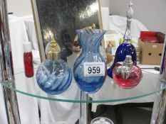 A collection of coloured glass items