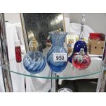 A collection of coloured glass items