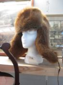 A fur hat with ear warmers