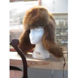 A fur hat with ear warmers