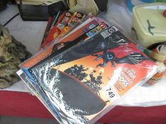 A collection of comics including DC, New Titans, The Shadow,