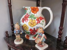 Two Hummel figures and a pottery water jug