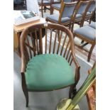 A slat back chair with upholstered seat