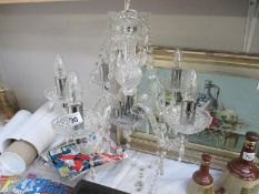 A 5 arm crystal glass chandelier