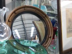 An oval nautical style mirror