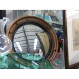 An oval nautical style mirror