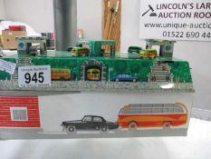 A tin plate automaton of buses and cars