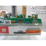 A tin plate automaton of buses and cars