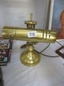 A brass desk lamp