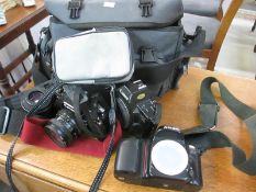 A quantity of cameras and accessories including Canon,