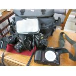 A quantity of cameras and accessories including Canon,