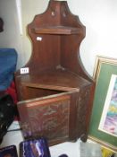 An old corner hanging wall cabinet