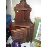 An old corner hanging wall cabinet