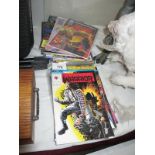 A collection of comics including Eternal Warrior, Hard Case,