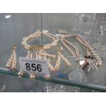 A collection of faux pearl jewellery items