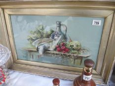 A framed oil painting of a still life scene