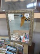 A brass framed bevel edged mirror 35.5 cm x 26.