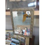 A brass framed bevel edged mirror 35.5 cm x 26.