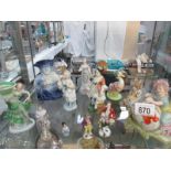 A collection of figurines including Victorian and Bunnykins