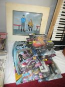 A collection of boxed Star Trek figurines and a Star Trek cartoon cell featuring Spock and Captain