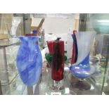 A collection ogf coloured vases etc