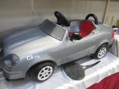 A childs toy ride in sports car