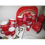 A collection of Nescafe mugs and KitKat items