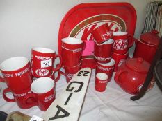 A collection of Nescafe mugs and KitKat items