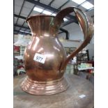 A copper jug with handle