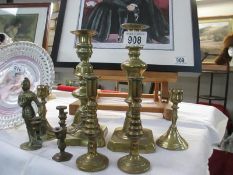 A good collection of brass candlesticks