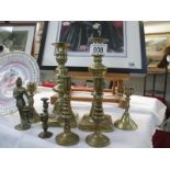 A good collection of brass candlesticks