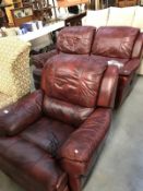 A red leather 2 seater settee & chair (all electric recliners)