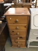 A solid pine 6 draw chest of drawers