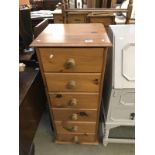 A solid pine 6 draw chest of drawers