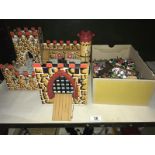A toy castle with plastic knight figures