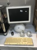 A vintage Apple i-MAC G4 with keyboard,