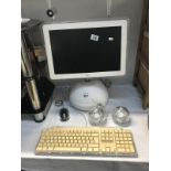 A vintage Apple i-MAC G4 with keyboard,