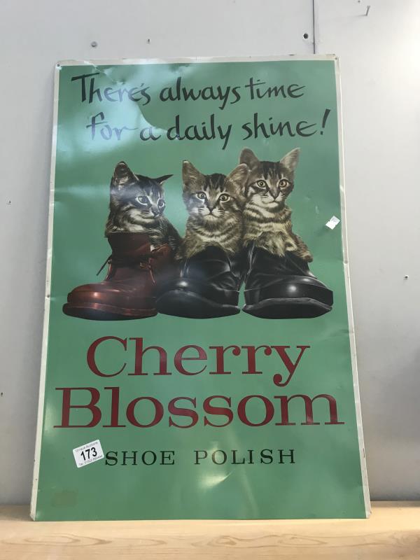 A cherry blossom shoe polish advertising sign