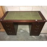 A darkwood stained office double pedestal desk with leather inset top