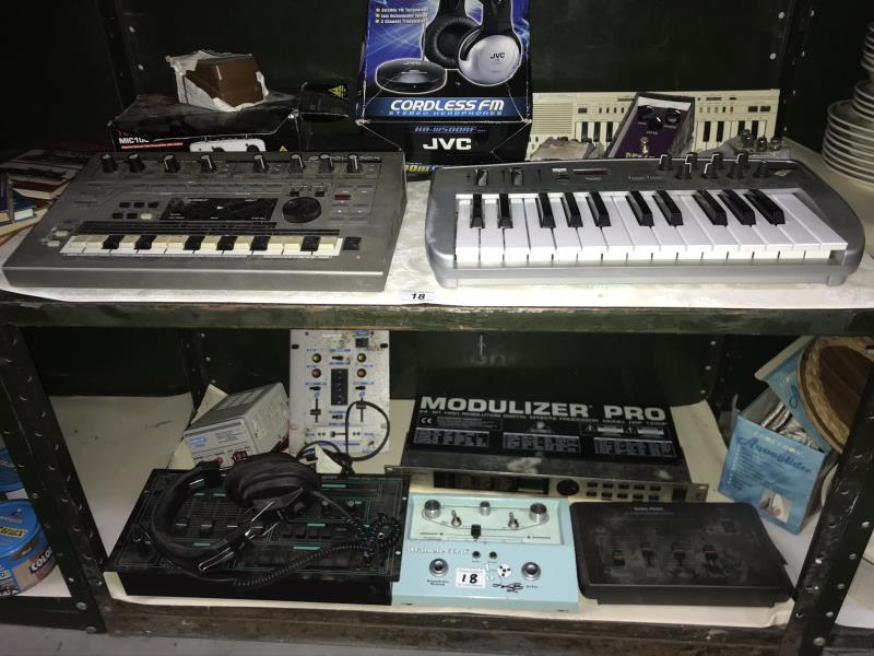 2 shelves of recording instruments etc for musicians including keyboards, pedals etc.