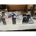 A Play Station 2 console and quantity of play station 2 games etc.