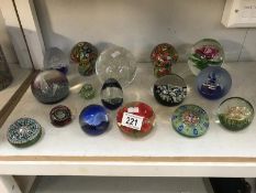 A quantity of glass paperweights including Caithness