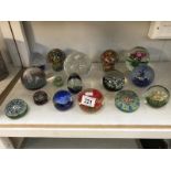 A quantity of glass paperweights including Caithness